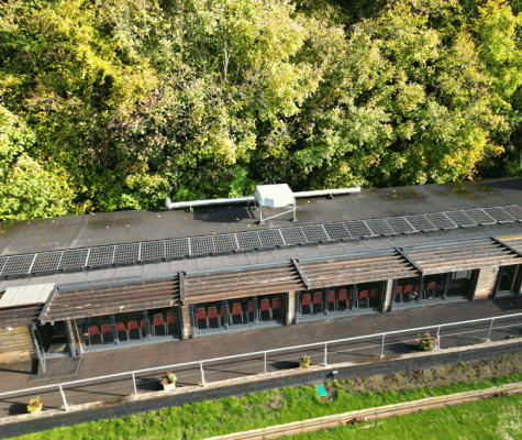 Aerial view of PV panels on the roof of Leatherhead Bowling Club