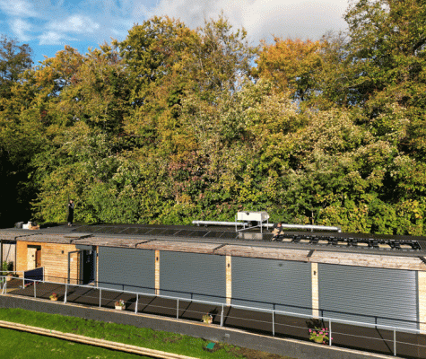 PV panels being installed on the roof of Leatherhead Bowling Club